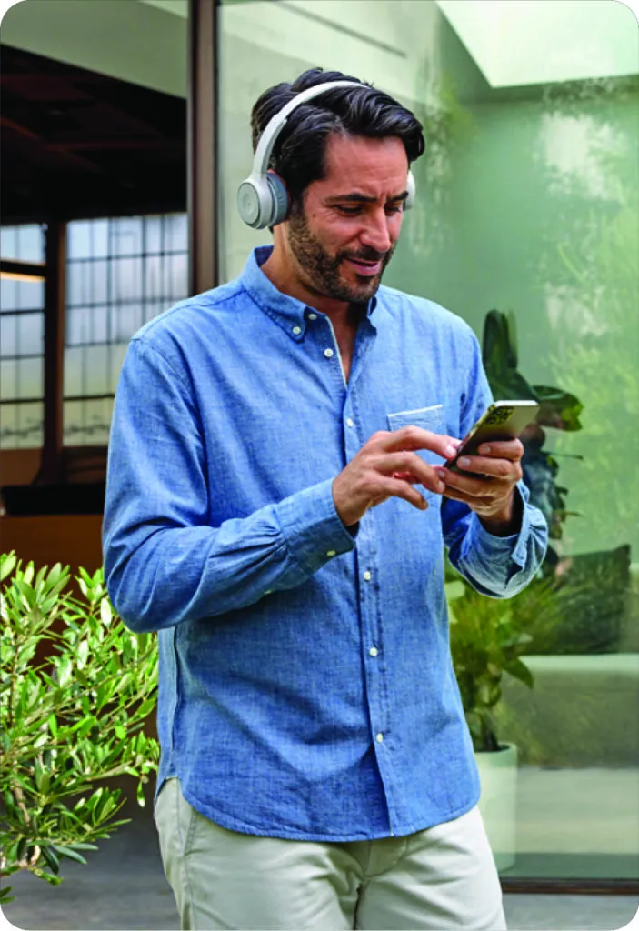 A person taking a work call on a mobile phone away from the office