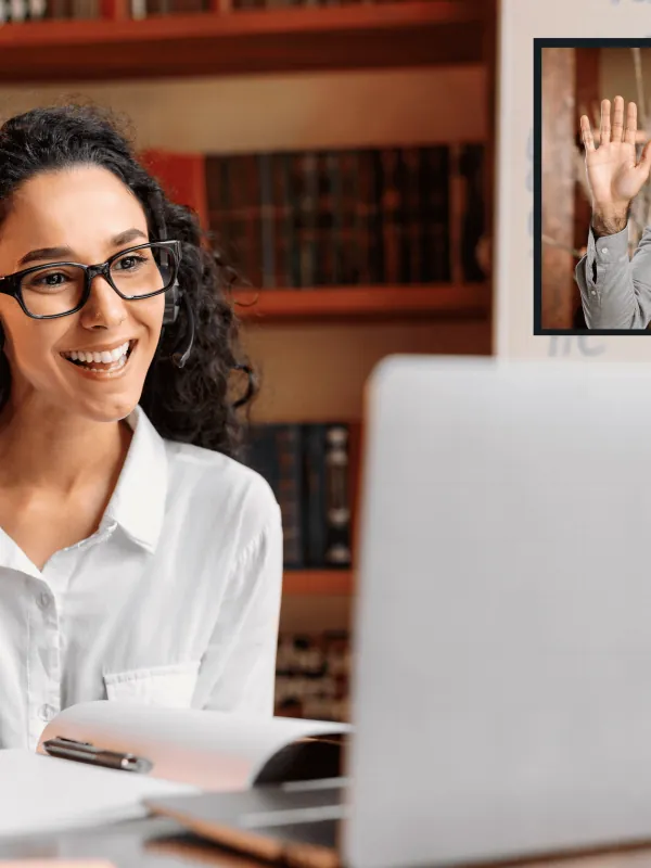 Employee working at a laptop during a video call