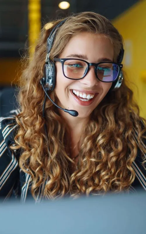 Woman wearing headphones taking part in an online meeting